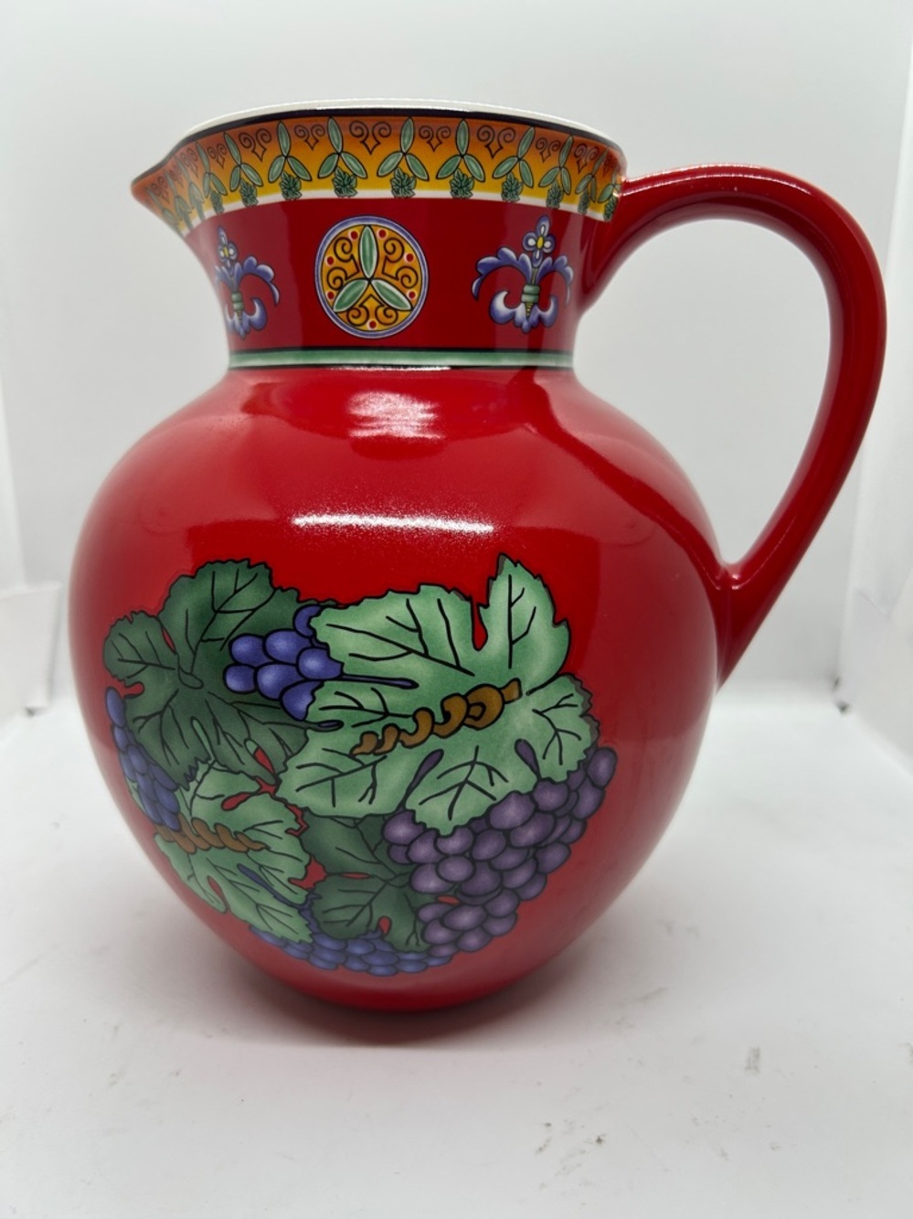 RARE CAESARS Red Ceramic Pitcher with Grape Motif.